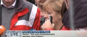 Angela Merkel verschafft sich in Passau ein Bild von den Hochwasserschäden.