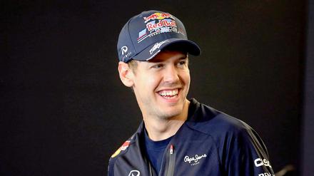 Hat gut lachen: Weltmeister Sebastian Vettel geht mal wieder als Favorit in die Saison.