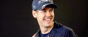 Hat gut lachen: Weltmeister Sebastian Vettel geht mal wieder als Favorit in die Saison.