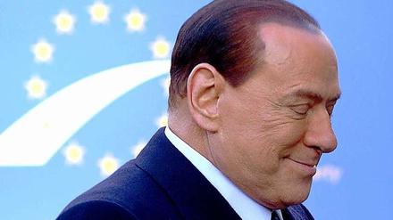 Schwer beschäftigt: Silvio Berlusconi.