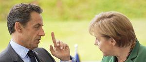 Da besteht Diskussionsbedarf. Sarkozy und Merkel (l.) müssen reden - über Griechenland.