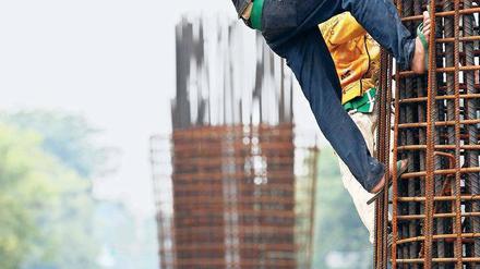 Wirtschaftswunder im Südosten. Bauarbeiter in Jakarta, Indonesien. Foto: rtr