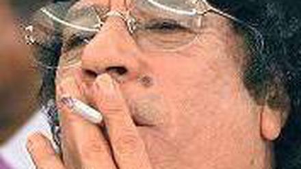 Muammar al Gaddfi.