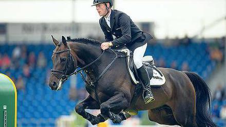 Auf dem Sprung in Aaachen. Marcus Ehning auf dem Pferd Singular la Silla.