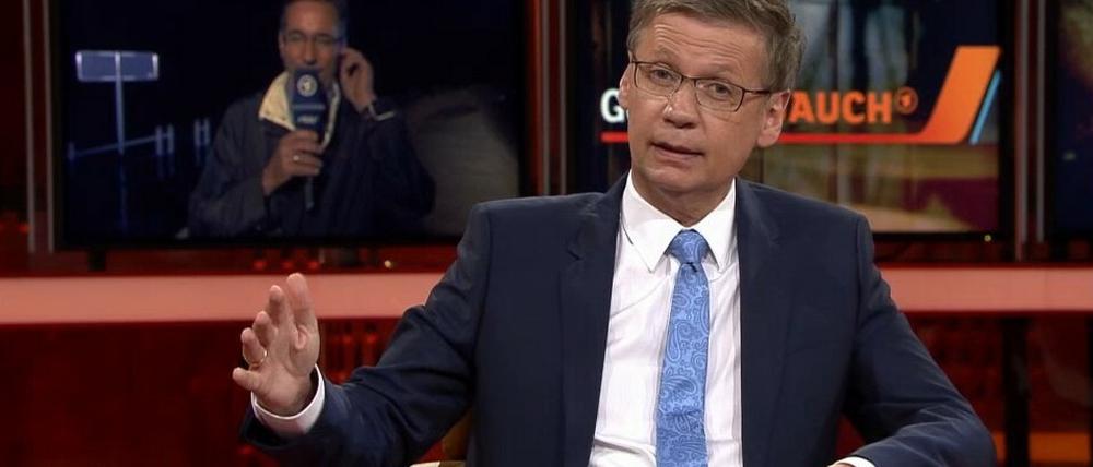 Potsdamer unter sich: Günther Jauch bittet Matthias Platzeck um einen Lagebericht von der Elbe.