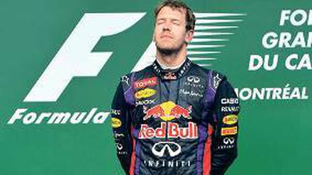 Erfolg zum Genießen. Sebastian Vettel bei der Siegerehrung in Montreal.