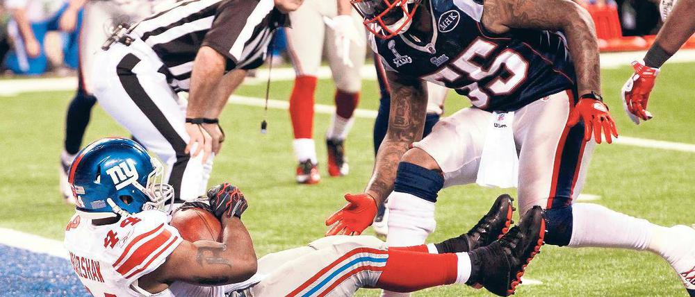 Zum Titel spaziert. New Yorks Ahmad Bradshaw hatte bei seinem entscheidenden Touchdown wenig Gegenwehr.