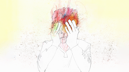 A man holding his face in his hands