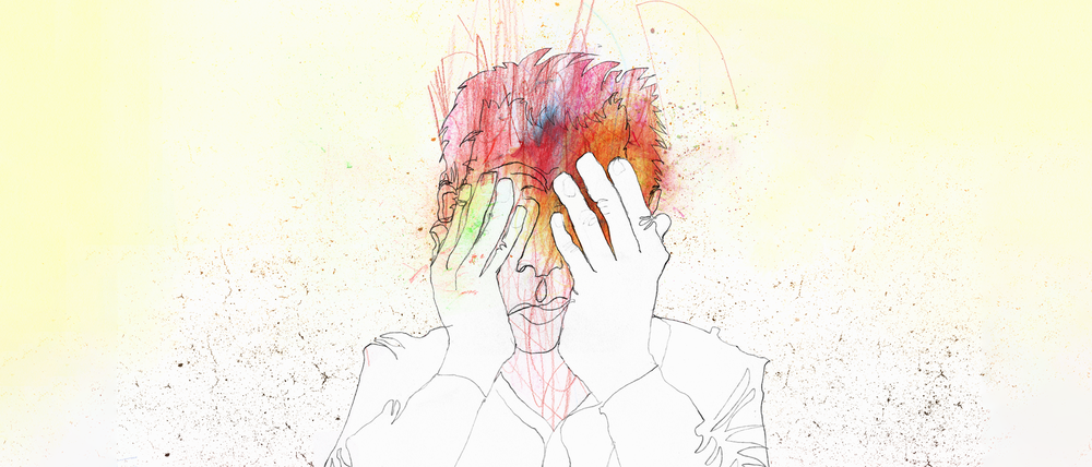 A man holding his face in his hands