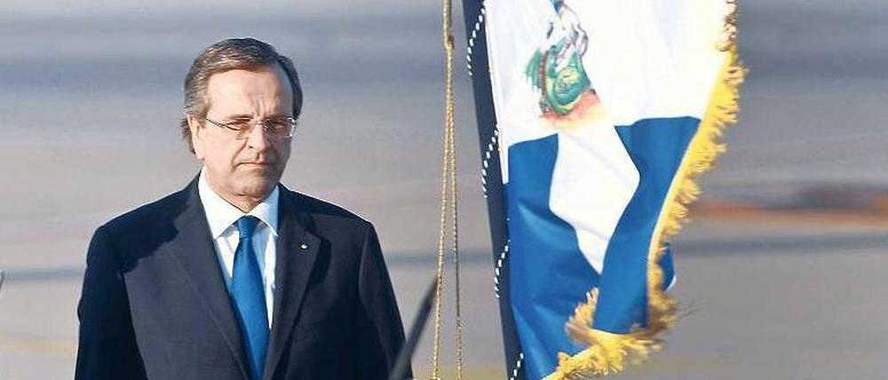 Zum Wohle des Staates. Der griechische Ministerpräsident Antonis Samaras muss den Haushalt sanieren. Ob das gelingt, sehen viele im Lande skeptisch. Foto: Yorgos Karahalis/Reuters