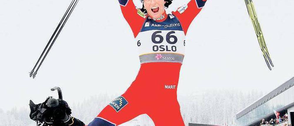 Ski-Springerin. Marit Björgen konnte bereits drei Goldmedaillen bejubeln.