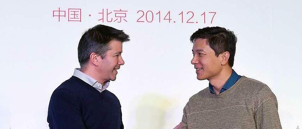Die Chefs von Uber (links) und Baidu arbeiten künftig enger zusammen.