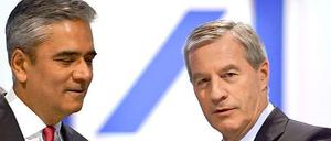 Weniger Geld auf dem Konto: Die Deutsche-Bank-Co-Chefs Anshu Jain (l.) und Jürgen Fitschen bekommen für 2014 deutlich weniger Gehalt als im Vorjahr.