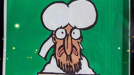Cover der jüngsten Ausgabe von "Charlie Hebdo": Der Prophet hält ein "Je suis Charlie"-Schild, darüber steht auf Französisch: "Alles ist vergeben". 