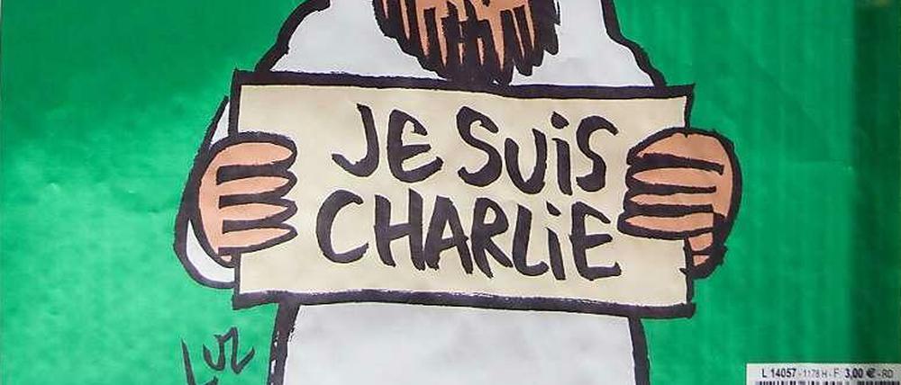 Cover der jüngsten Ausgabe von "Charlie Hebdo": Der Prophet hält ein "Je suis Charlie"-Schild, darüber steht auf Französisch: "Alles ist vergeben".