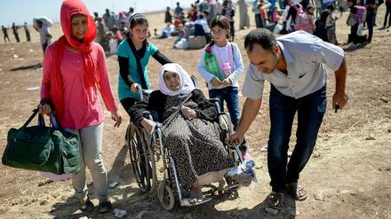 Ohne Heimat, ohne Hoffnung: Wie hier an der türkischen Grenze sind syrische Flüchtlinge auf Hilfe angewiesen. Das gilt auch für die Aufnahmestaaten.