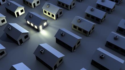"housing estate in the night, just one house with light"