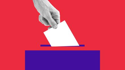 The human hand drops the ballot into the box.