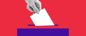 The human hand drops the ballot into the box.