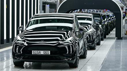 FILE PHOTO: Model Y cars are pictured at theTesla Gigafactory for electric cars in Gruenheide, Germany, March 22, 2022. Patrick Pleul/Pool via REUTERS/File Photo