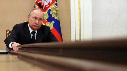 Russian President Vladimir Putin chairs a meeting with members of the Russian government via teleconference in Moscow on March 10, 2022. - Russia announced an export ban on more than 200 types of foreign-made products and equipment until the end of the year, part of Moscow's response to sanctions imposed over the Ukraine conflict on March 10. (Photo by Mikhail KLIMENTYEV / SPUTNIK / AFP)