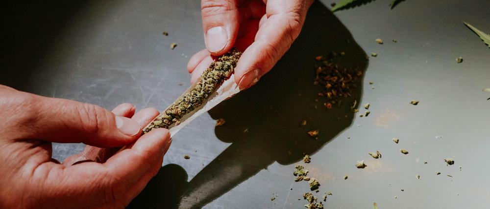 Person holding joint.