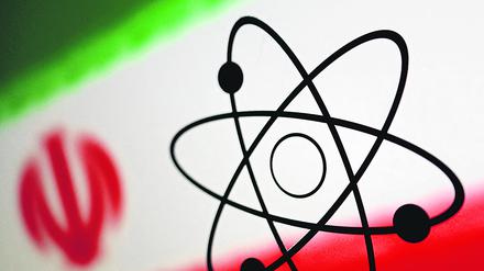 FILE PHOTO: The atomic symbol and the Iranian flag are seen in this illustration, July 21, 2022. REUTERS/Dado Ruvic/Illustration/File Photo