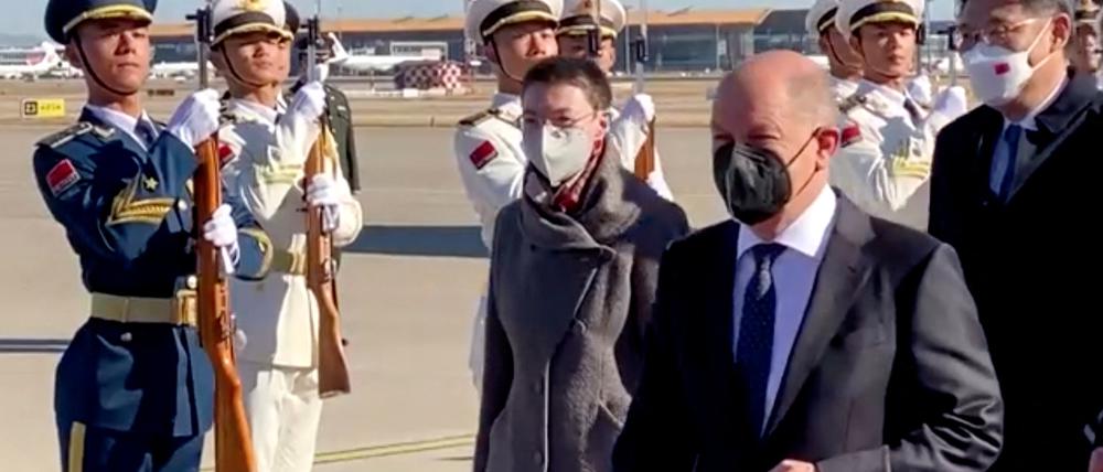 German Chancellor Olaf Scholz walks after disembarking a plane at the Beijing Capital International Airport, in Beijing, China November 4, 2022 in this still image taken from video. REUTERS/via Reuters TV REFILE - QUALITY REPEAT
