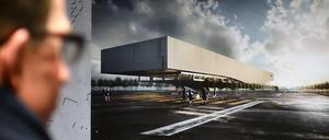 Ein Mann betrachtet am 04.02.2014 auf dem Gelände des ehemaligen Flughafen Tempelhof in Berlin bei der Ausstellungseröffnung der Entwürfe für den Neubau der Zentral- und Landesbibliothek Berlin den Entwurf des Architekturbüros Kohlmayer-Oberst-Architekten. Den ersten Platz des Wettbewerbs teilen sich die Büros Kohlmayer-Oberst-Architekten und das Architektenduo Miebach/Oberholzer. Die Ausstellung läuft noch bis zum 28.02.2014. Foto: Britta Pedersen/dpa ++ +++ dpa-Bildfunk +++