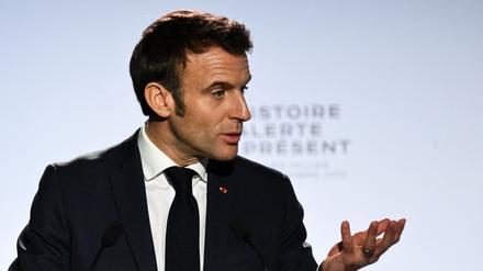 French President Emmanuel Macron gestures as he delivers a speech at the Camp des Milles memorial site, in Aix-en-Provence, southeastern France, on December 5, 2022. (Photo by CHRISTOPHE SIMON / POOL / AFP)