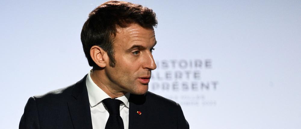 French President Emmanuel Macron gestures as he delivers a speech at the Camp des Milles memorial site, in Aix-en-Provence, southeastern France, on December 5, 2022. (Photo by CHRISTOPHE SIMON / POOL / AFP)