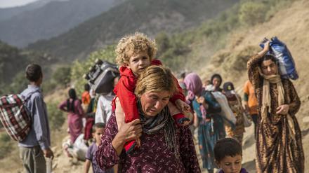 Auf der Flucht: Jesiden versuchen 2014, sich vor den Angriffen des IS in Sicherheit zu bringen.