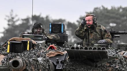 German Defense minister Boris Pistorius rides a tank as he visits Leopard II tanks that are due to be supplied to Ukraine at the tank brigade Lipperland of Germany's army and part of the Bundeswehr, in Augustdorf, Germany, February 1, 2023. REUTERS/Benjamin Westhoff