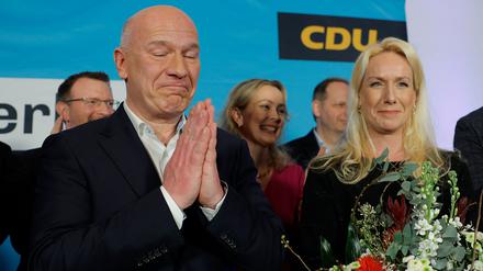 Christian Democratic Union (CDU) party's top candidate Kai Wegner (L) celebrates next to his partner Katleen Kantar after the first exit poll results for the Berlin state's repeat elections at the State parliament in Berlin on February 12, 2023. - German Chancellor Olaf Scholz's Social Democrats suffered a loss on February 12, 2023 in Berlin state elections, coming second to the conservative opposition, according to initial estimates by public broadcasters. The Christian Democratic Union (CDU) won around 28 percent of the vote in the election for Berlin's regional parliament, while Scholz's SPD scored about 18 percent, its worst postwar result, according to the estimates by broadcasters ARD and ZDF. (Photo by Odd ANDERSEN / AFP)