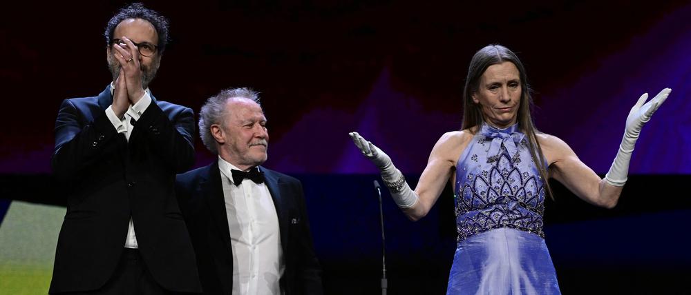 (L-R) Berlinale Artistic Director Carlo Chatrian, French director Nicolas Philibert and Berlinale Executive Director Mariette Rissenbeek are seen on stage during the award ceremony of the 73rd Berlinale International Film Festival in Berlin, on February 25, 2023. (Photo by John MACDOUGALL / AFP)