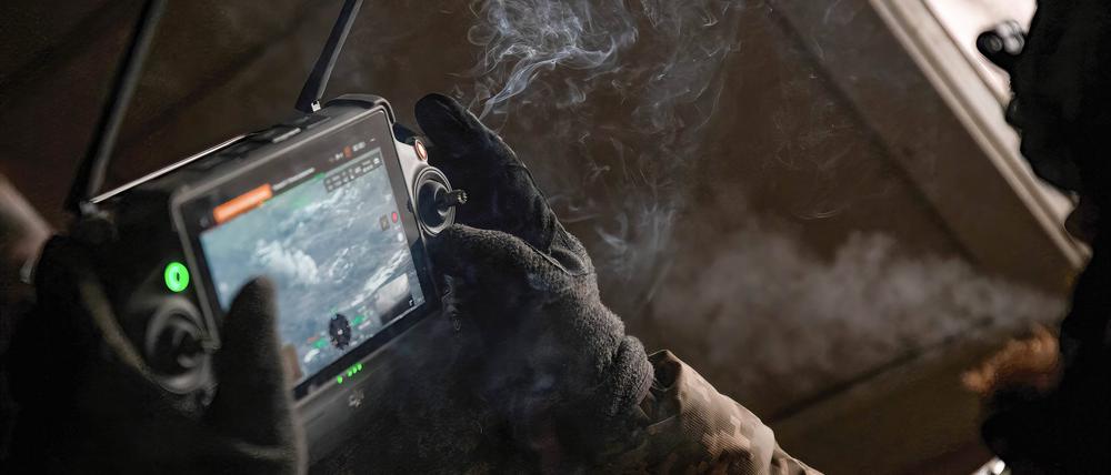 December 29, 2022, Bahkmut, Ukraine: Leonid, a Ukrainian drone operator watches as artillery strikes Russian positions. Leonid joined the Ukrainian armed forces shortly after the invasion in Februrary, and now works to correct artillery fire. Bahkmut Ukraine - ZUMAs197 20221229_zab_s197_035 Copyright: xMadeleinexKellyx