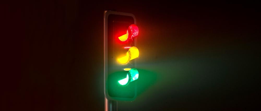 Traffic light on foggy night