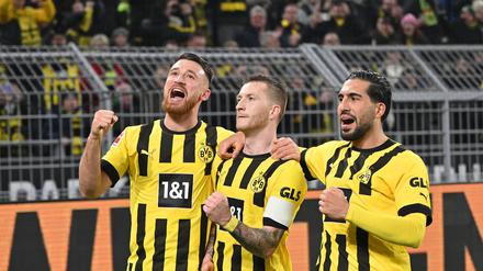 Die Nationalspieler Emre Can (rechts) und Marco Reus (Mitte) erzielten gegen Leipzig die Tore.