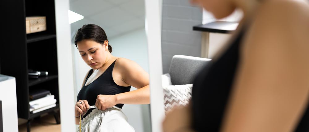 Woman Weight Loss And Dieting. Measuring Waist Size Sad Depression