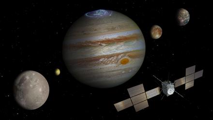 Eine Illustration zeigt „Juice“ vor dem Jupiter (Mitte) und seinen vier Eismonden (von links): Ganymed, Io, Europa und Kallisto. Drei wird die Sonde erkunden.