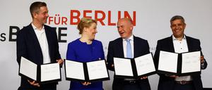 Secretary General of the Christian Democratic Union party (CDU) Stefan Evers, Outgoing Governing Mayor of Berlin and leader of Berlin's Social Democratic Party (SPD) Franziska Giffey, Governing Mayor of Berlin designate and leader of Berlin's CDU Kai Wegner and Chairman of the SPD Berlin Raed Saleh attend an event to sign the coalition treaty in Berlin, Germany, April 26, 2023. REUTERS/Christian Mang