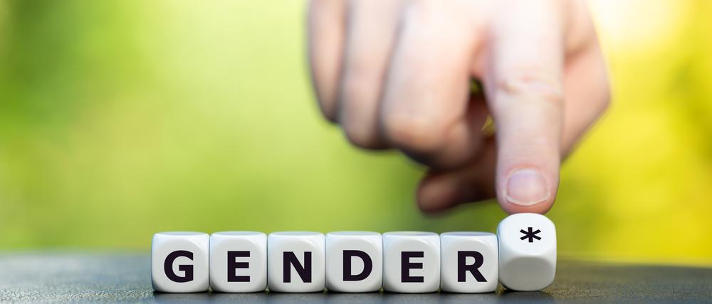 Dice form the expression "gender*" (gender star). A symbol for a gender equitable administrative language in Germany.