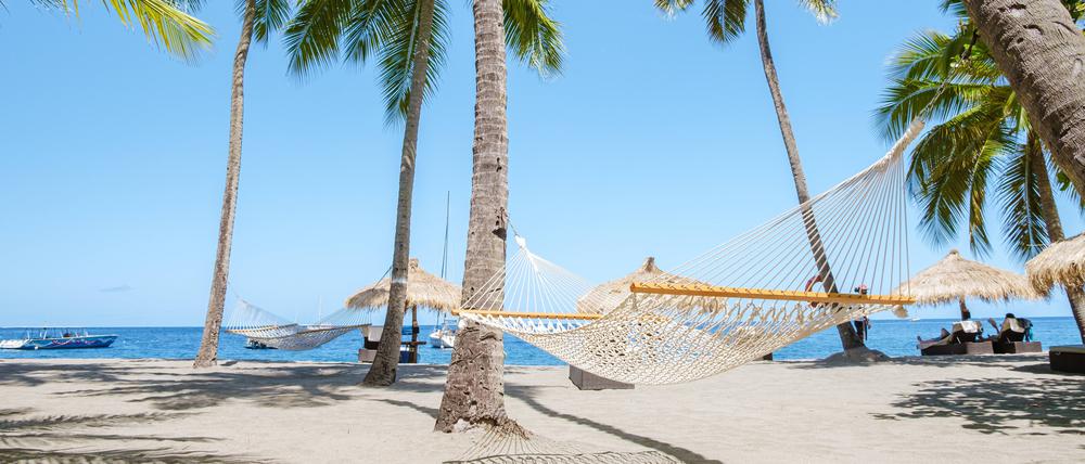 Strand in der Karibik: Das Tui-Management erwägt den Kauf einer eigenen Insel.