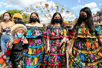 Women and girls wearing protective face masks and traditional dresses gather during the Chiapas Grand Festival as Mexico posts record numbers of daily coronavirus disease (COVID-19) cases, in Chiapa de Corzo, Mexico January 15, 2022. REUTERS/Jacob Garcia