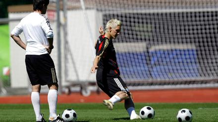 Coach Loew watches Schweinsteiger practice penalties during a training session of the German national soccer team during the Euro 2008 in Tenero