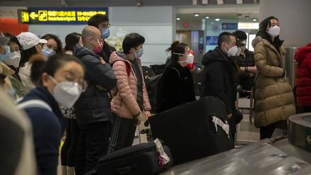 Flugreisende in Peking
