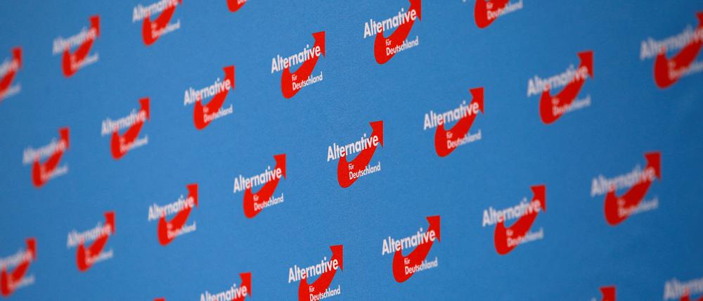 FILE PHOTO: Party's logos are displayed at the venue before the start of the Alternative for Germany (AfD) two-day party congress in Augsburg, Germany, June 30, 2018.  REUTERS/Michaela Rehle/File Photo