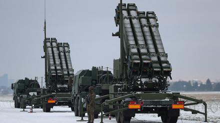 FILE PHOTO: Serviceman patrols in front of the Patriot air defence system during Polish military training on the missile systems at the airport in Warsaw, Poland February 7, 2023. REUTERS/Kacper Pempel/File Photo