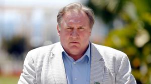 (FILES) French actor and newly-minted Russian citizen Gerard Depardieu poses on June 6, 2013 after holding a press conference dedicated to the launch of the first Russian film festival in Nice, in southeastern France. French police summoned Depardieu over suspected sexual assault, a police source said on April 29, 2024. Depardieu already faces a rape charge and sexual assault investigation, as well as claims of assault by more than a dozen women -- all of which he has strongly denied. (Photo by Valery HACHE / AFP)