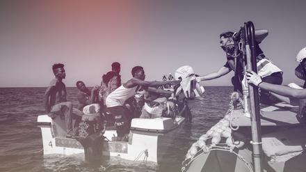Migranten vor der Küste Libyens erhalten Hilfe durch die Besatzung eines Seenotrettungsschiffes. 